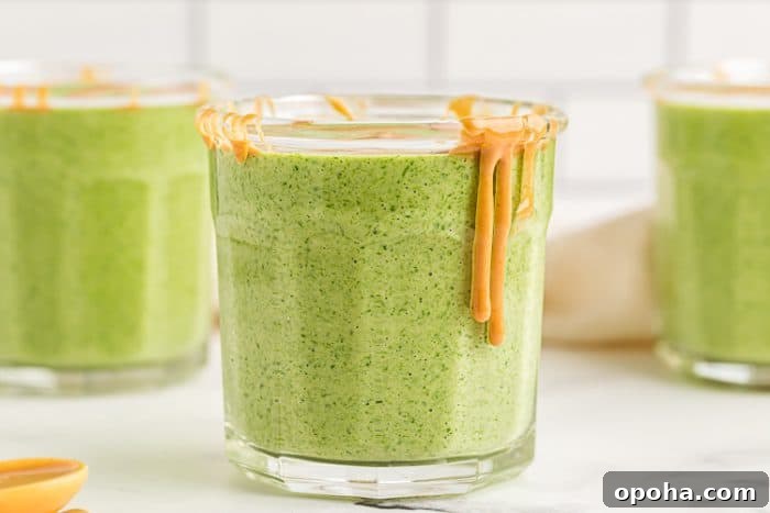 Keto Chocolate Smoothie or Creamy Pudding 7 three glasses of keto banana smoothies with peanut butter dripping over the side